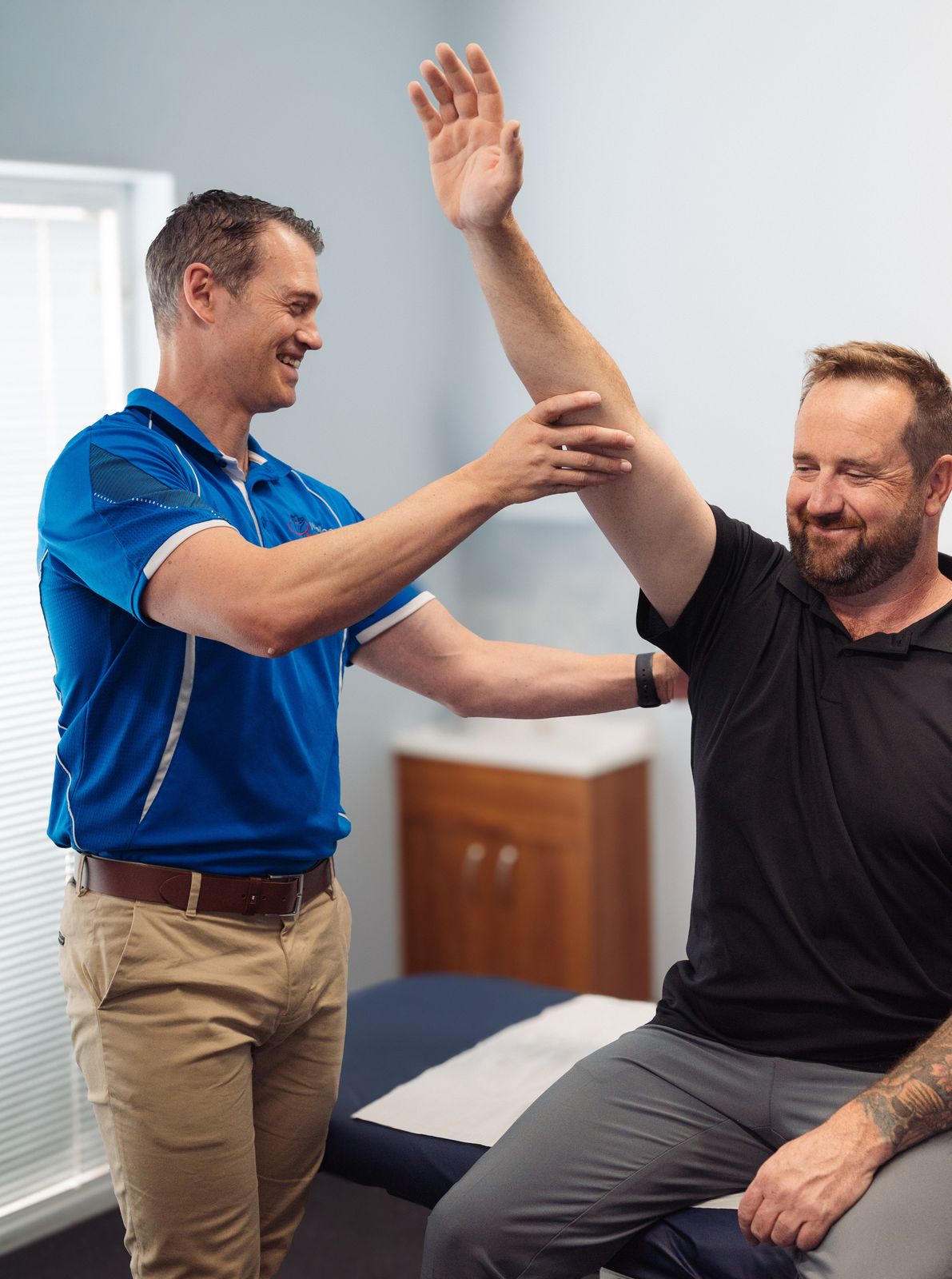 Physiotherapist conducting a patient assessment